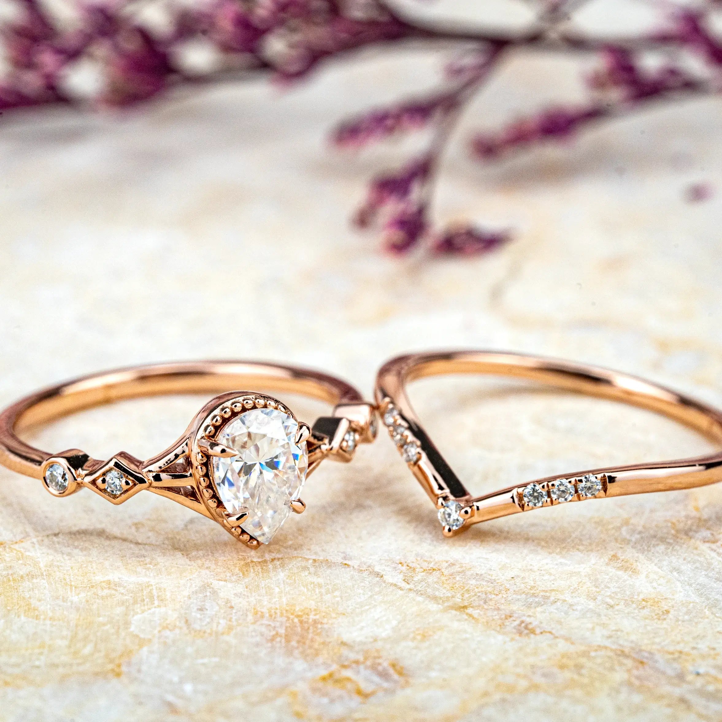 Ethereal Ring: a minimalist, custom handmade Moissanite proposal ring set. Features a pear-cut Moissanite on a rose gold band, blending modern elegance with classic romance. Perfect for an unforgettable engagement.